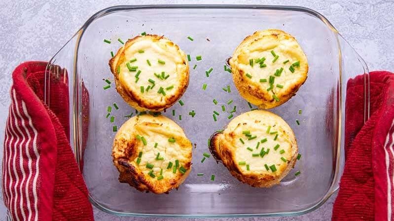 Four freshly baked twice baked cheese souffle
