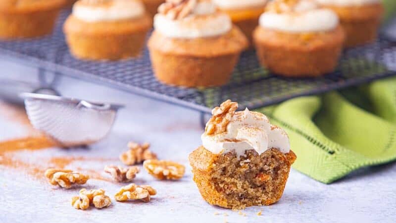 Bite removed from a carrot cake cupcake