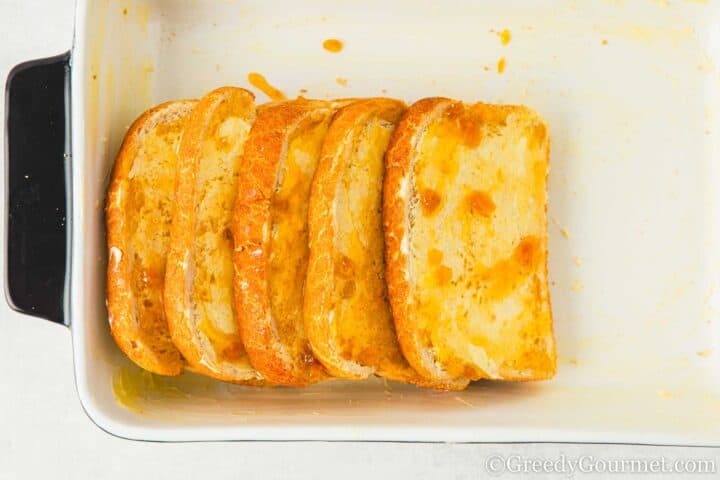 Buttered bread in a dish.