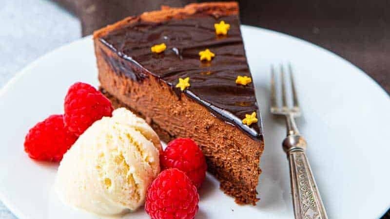 Full chocolate delice cake with a slice removed