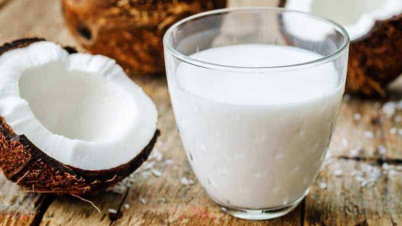 Glass of white coconut milk to be used as a Coconut cream substitute