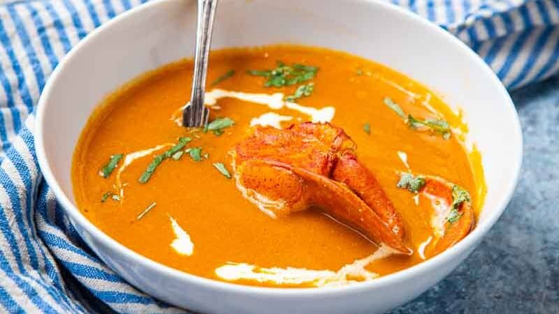 Bowl of orange lobster bisque