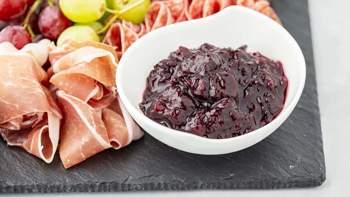 Meat platter with a chutney in a bowl