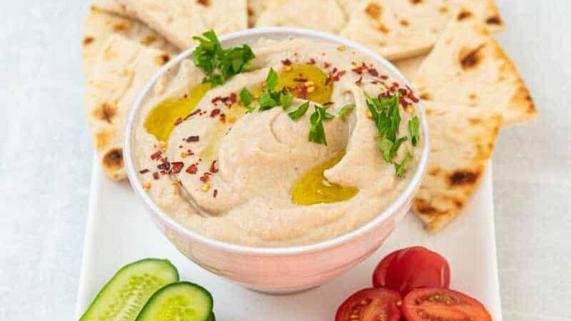 Bowl of mutabal and fresh cut vegetables