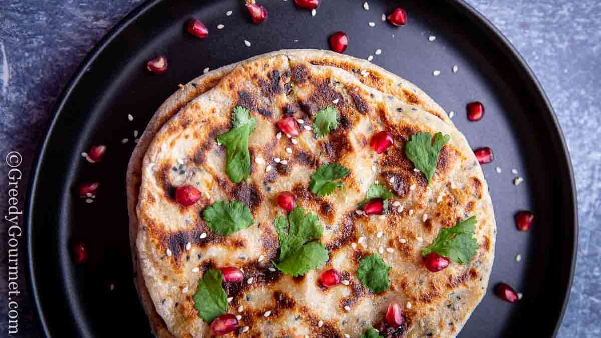 Plate of peshwari naan with basil