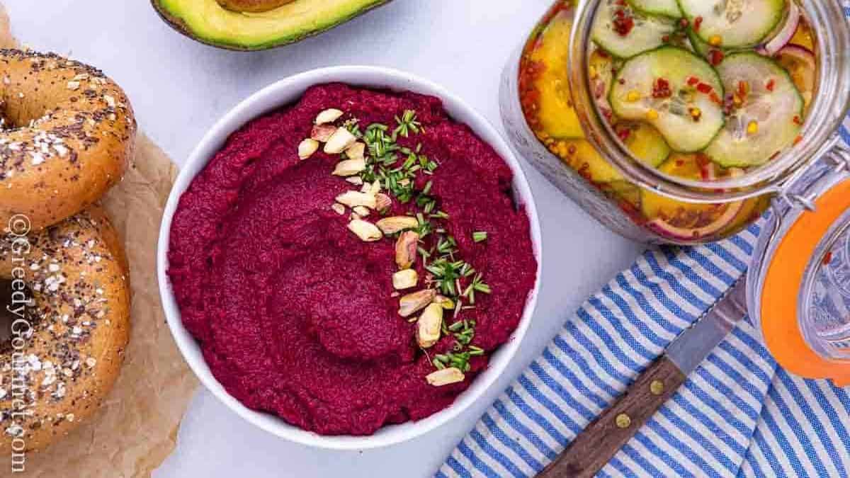 Bowl of a purple roasted beet recipe with an avocado