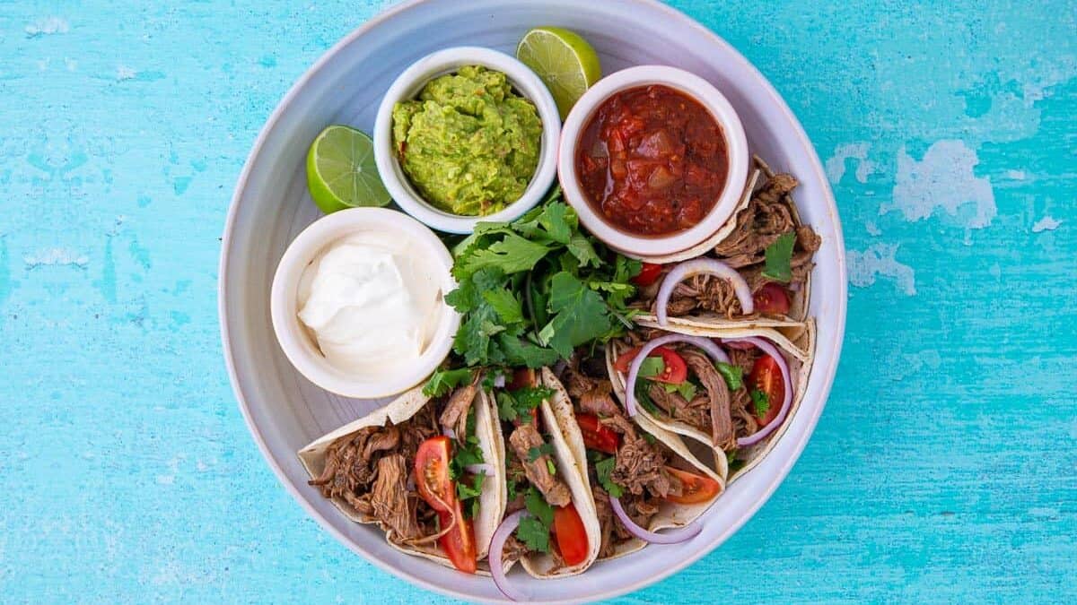 Aerial view of mexican tacos and salsa
