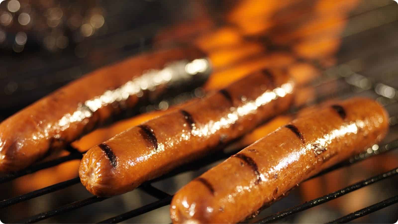 Sizzling grilled hotdogs.