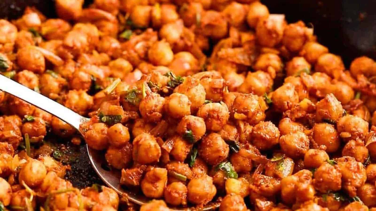 Cooked chickpeas in a heavy bottom skillet. 