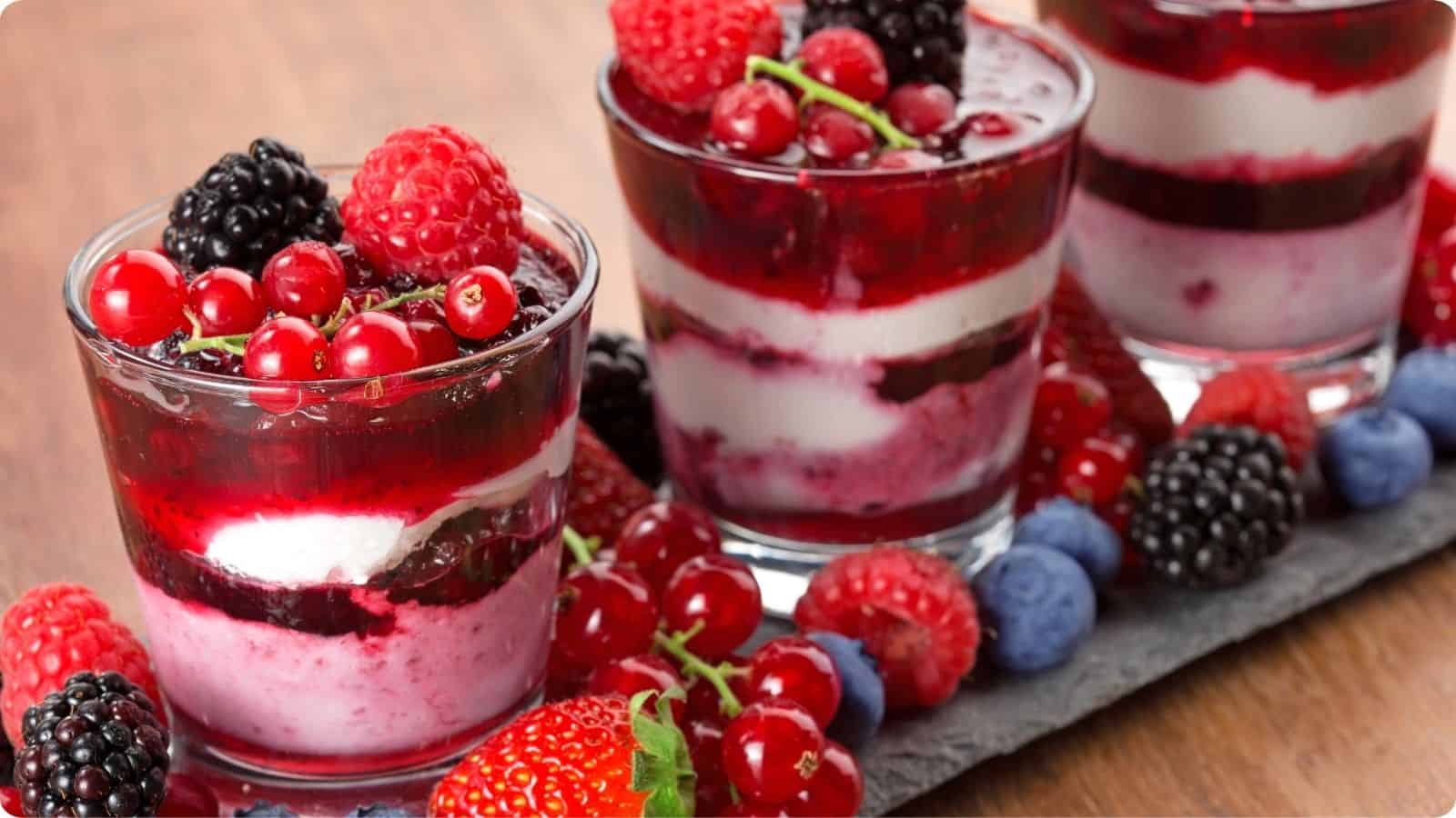 Strawberry yogurt, jam and jelly in a glass serve on the table.