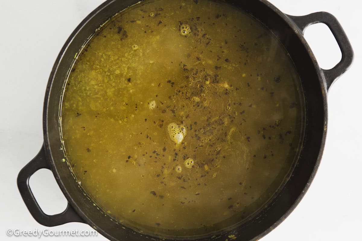 Chicken stock in a pot.