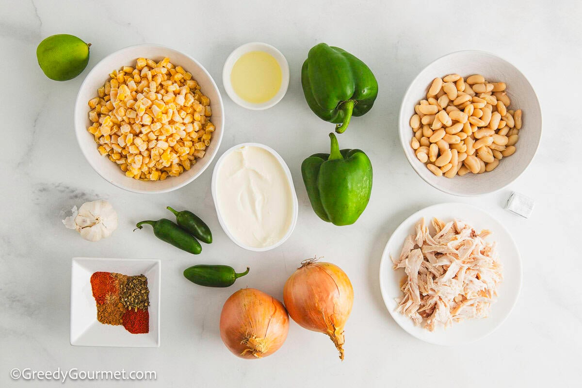 Ingredients for white chicken chili laid on a table.