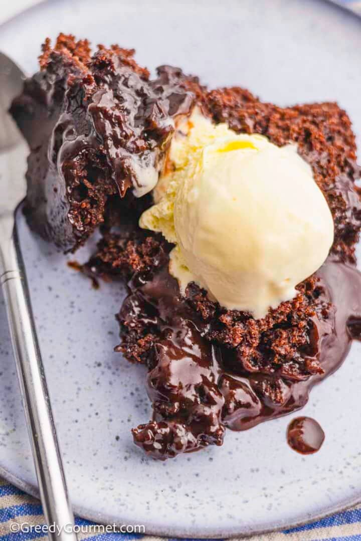 Chocolate lava cake served with a scoop of ice cream.