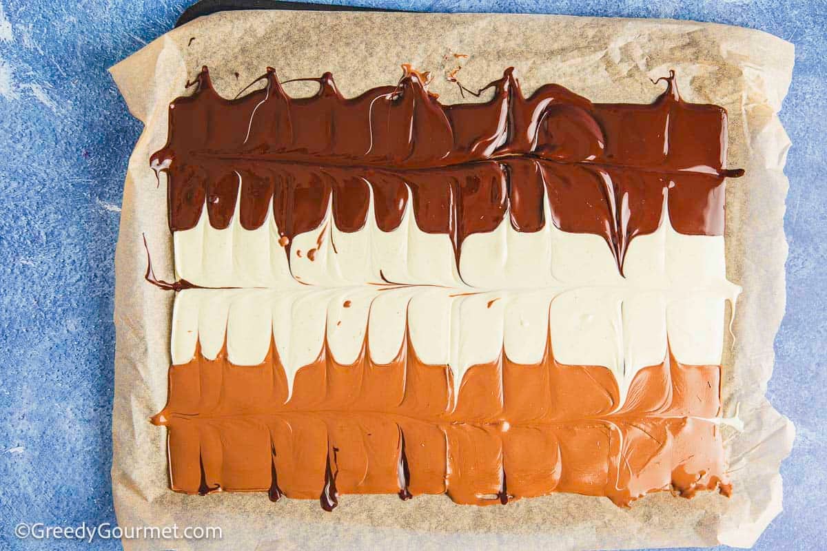 Melted slabs of chocolate on a baking sheet.