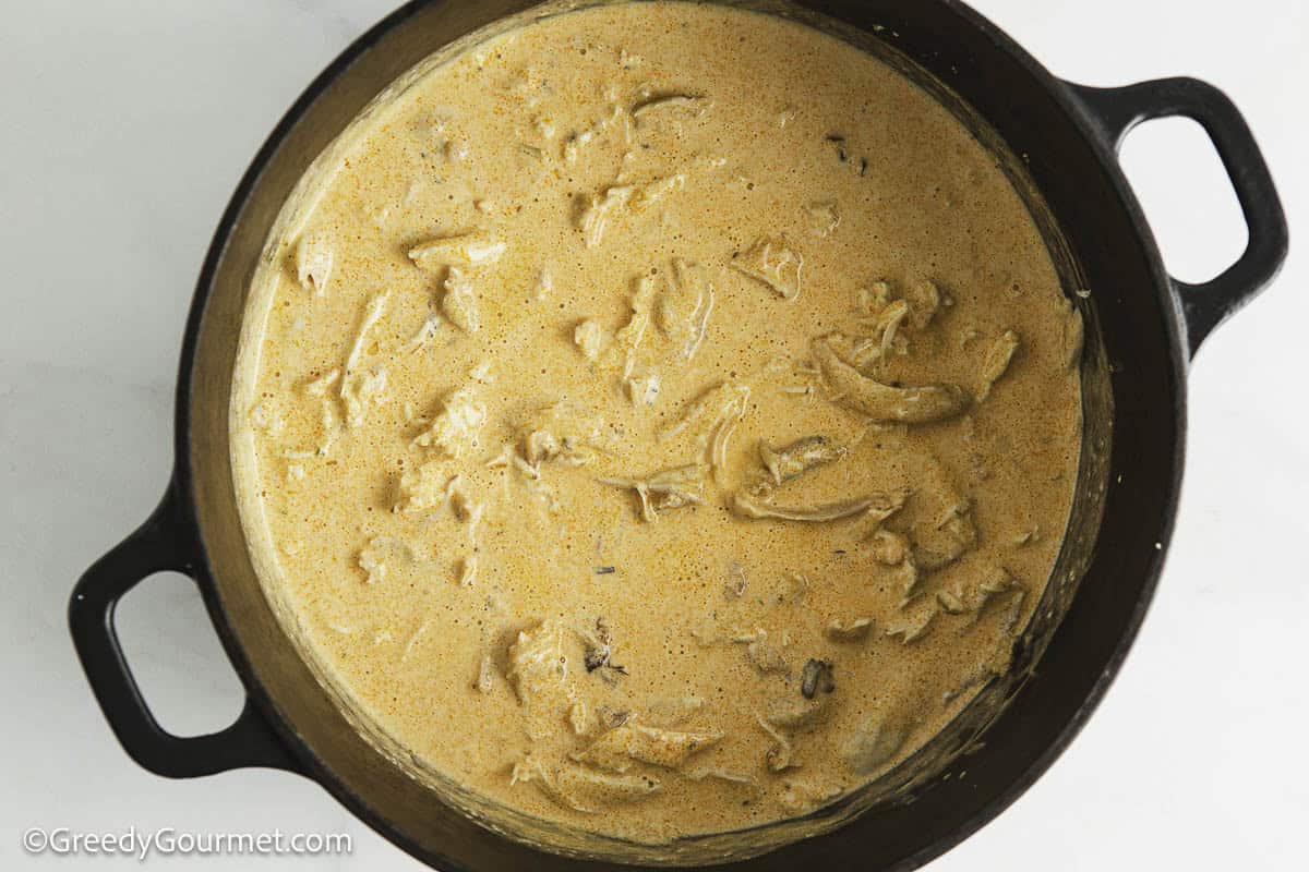 Warming up a cheese sauce.