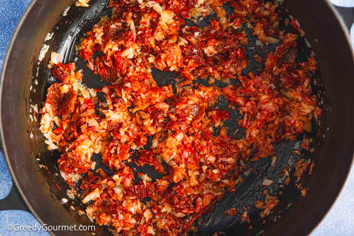 Tomato and onion in a pan.