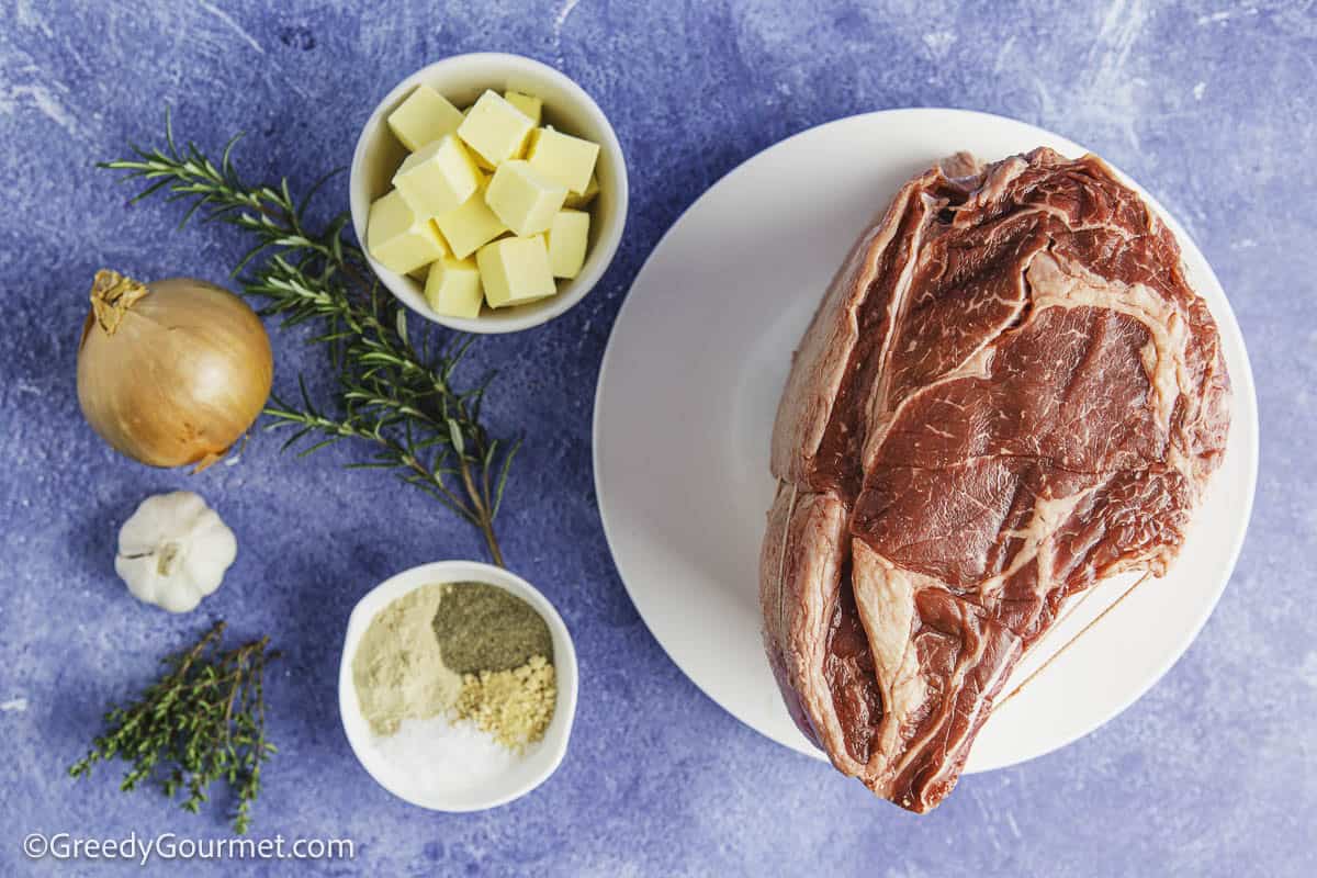 The ingredients for standing rib roast on a table.