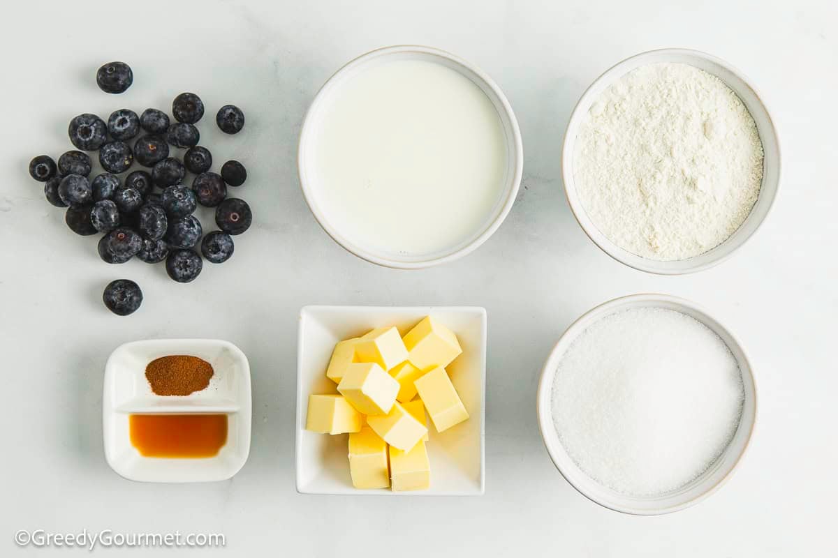 Ingredients for blueberry cobbler on a table.