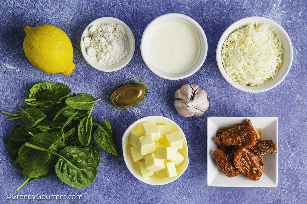 Ingredients for marry me salmon on a table.