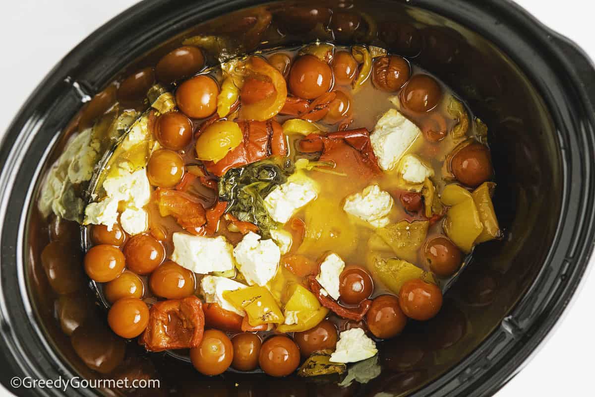 Cooked veggies in a slow cooker.