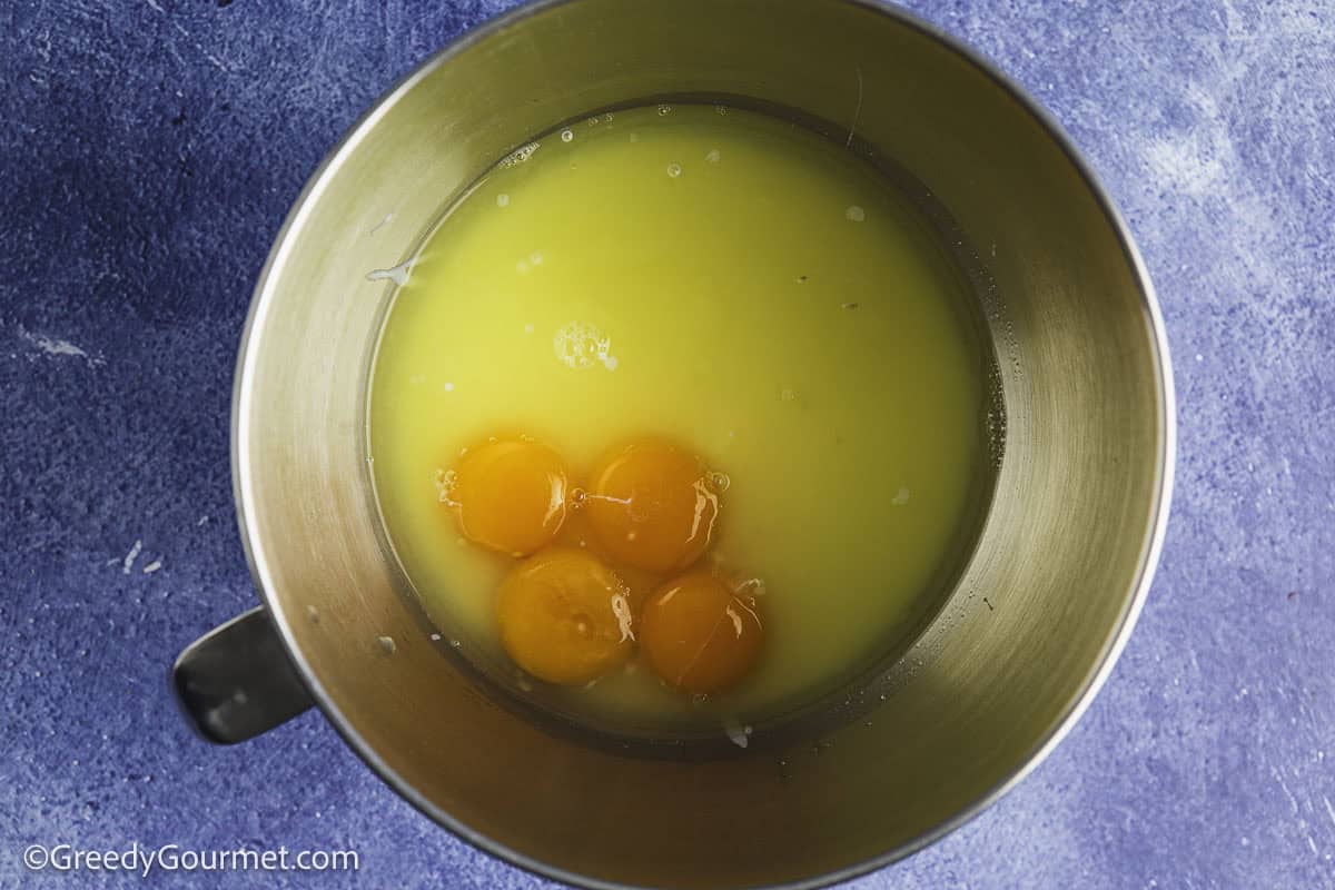 Condensed milk and egg in a mixing bowl.