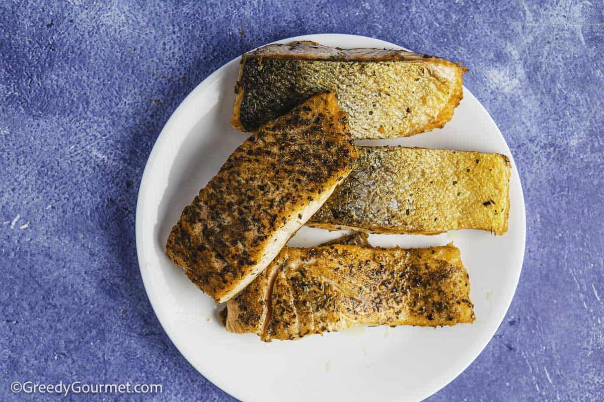 Salmon fillets on a plate.