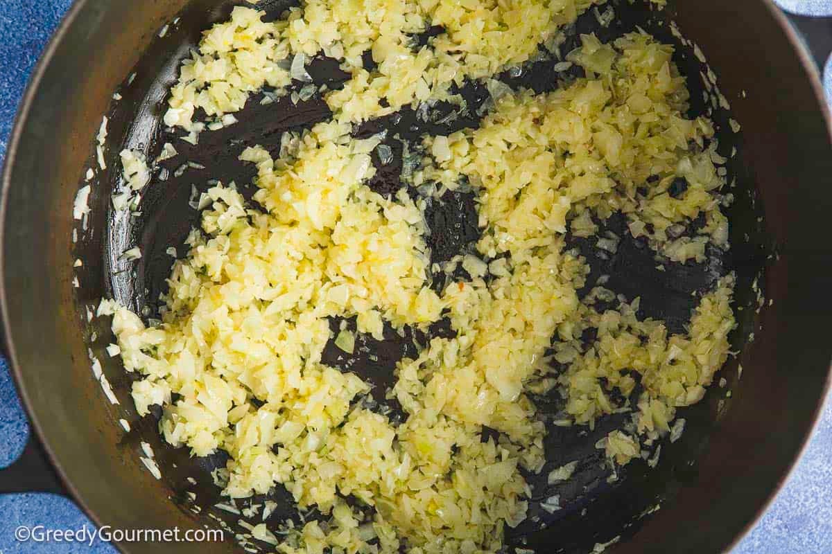 Frying onion in a pan.