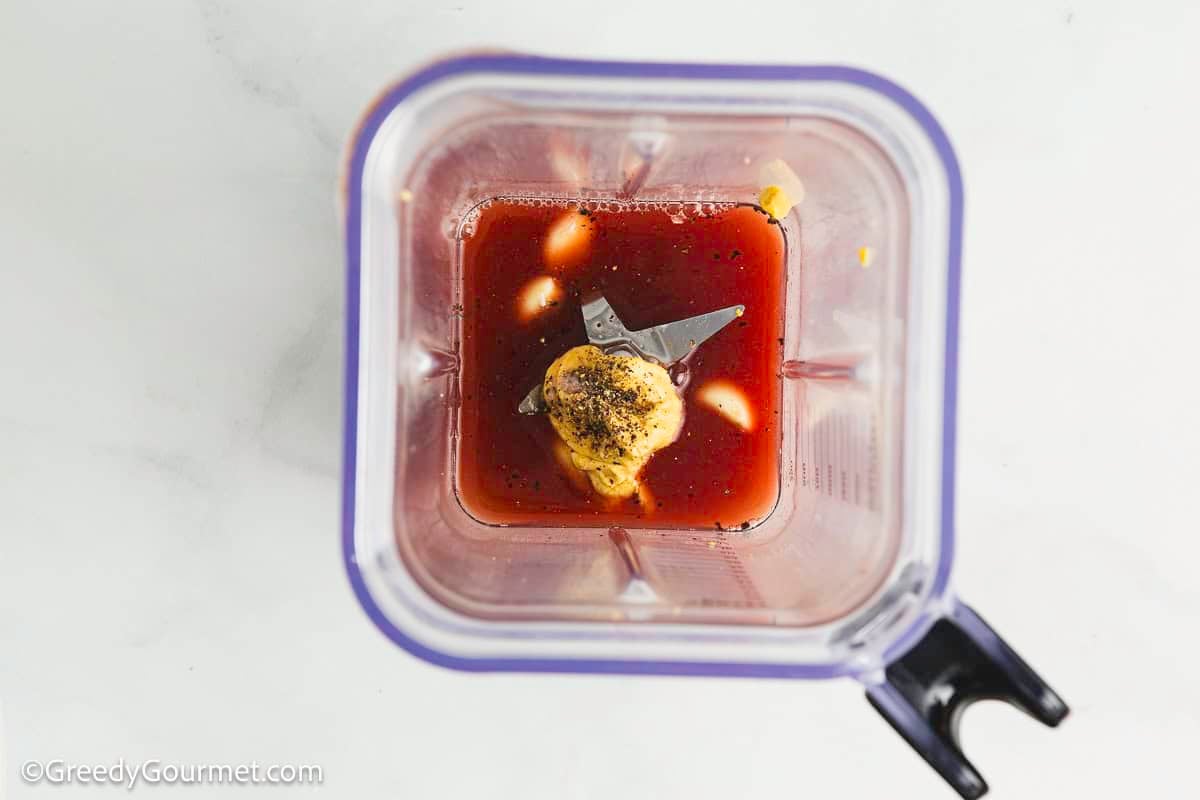 Ingredients for Greek salad dressing in a blender.
