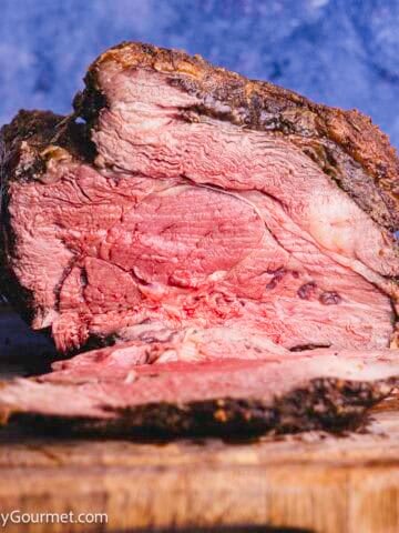 Standing Rib Roast on a wooden board.