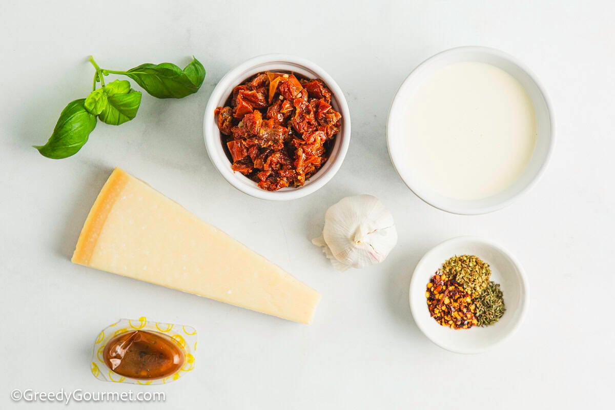 Ingredients for marry me chicken sauce on a table.